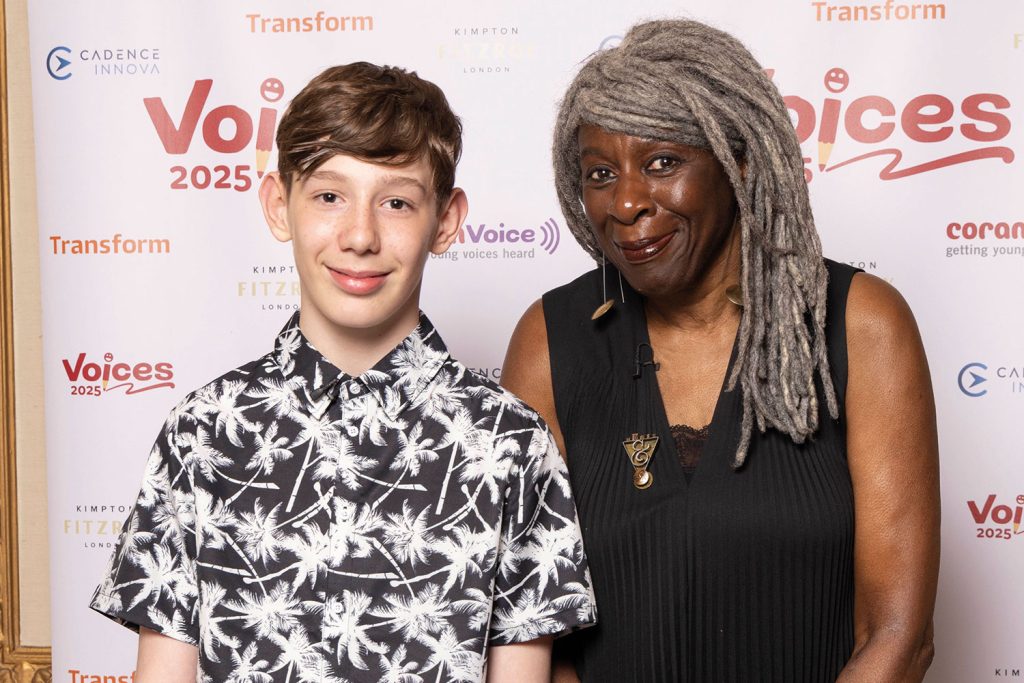 Host Ashley John-Baptiste (third from right, standing) with winners, judges and supporters of
Voices 2025