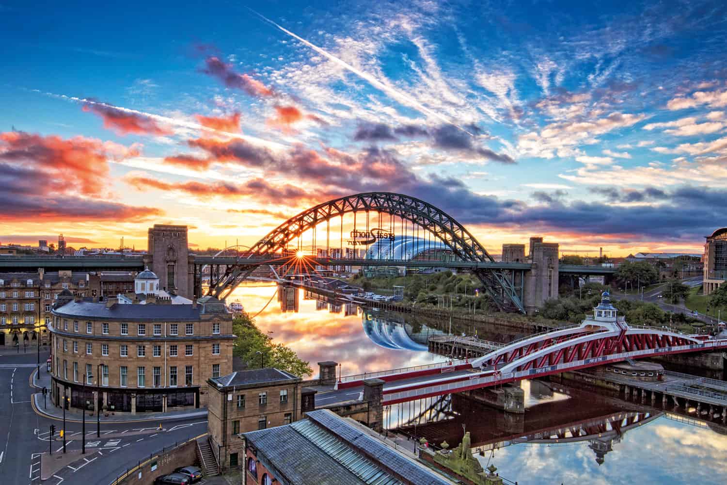 sunset over the Newcastle riverfront and bridges