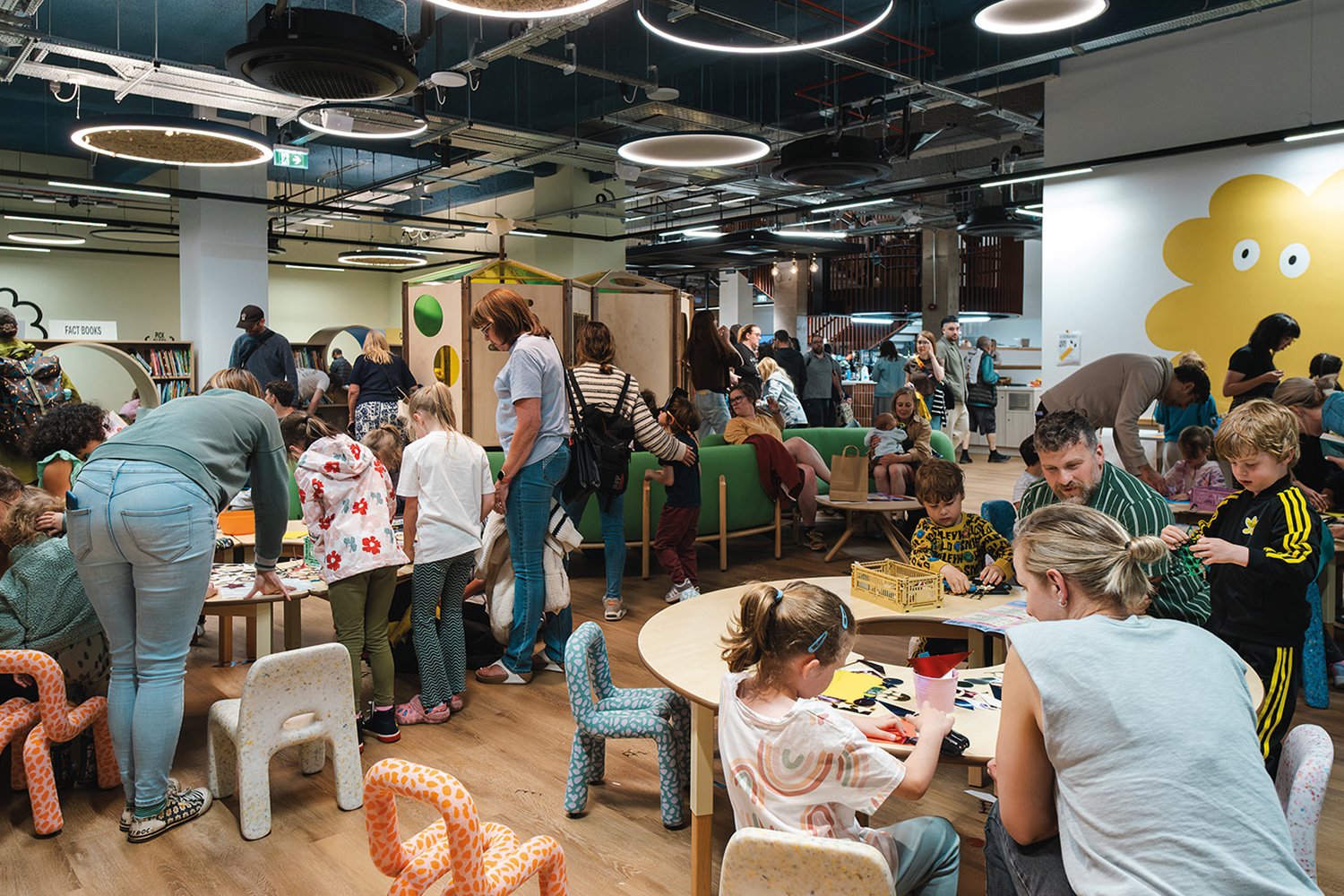 photos of people and children in Stockport’s Stockroom, a civic space and library at the heart of a regenerated shopping centre