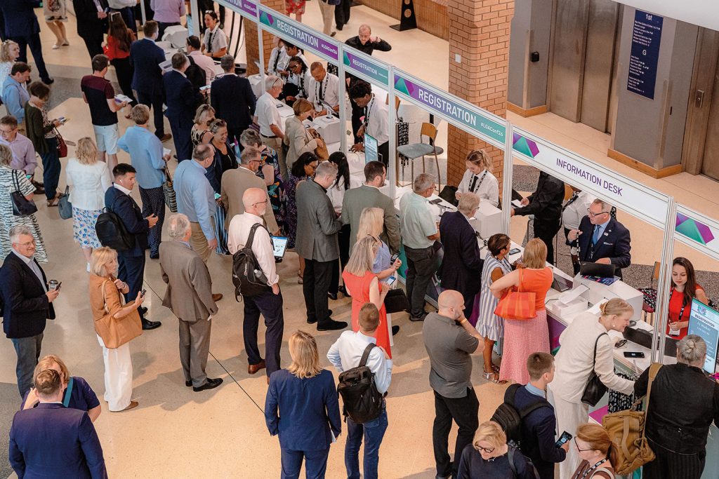 Crowd of councillors registering at the LGA conference desk