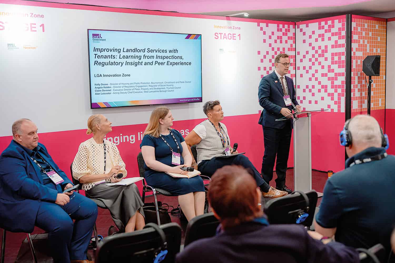 photo of Cllr Peter Mason, Chair of the LGA’s Improvement Committee, alongside a panel of speakers in the conference’s Innovation Zone